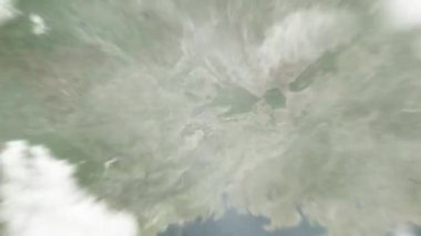 Dünya, WuHsiang Meydanı 'ndaki Nanning, Çin' e uzayda yakınlaşır. Arkasından bulutlar ve atmosferden uzaya zum geliyor. Uydu görüntüsü. Seyahat girişi