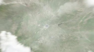 Dünya uzaydan Shenyang, Çin 'e yakınlaşır. Arkasından bulutlar ve atmosferden uzaya zum geliyor. Uydu görüntüsü. Seyahat girişi