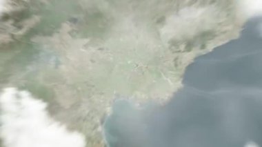 Dünya uzaydan Tangshan, Çin 'e yakınlaşır. Arkasından bulutlar ve atmosferden uzaya zum geliyor. Uydu görüntüsü. Seyahat girişi