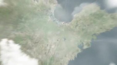 Dünya uzaydan Weifang 'a, Çin Kültür Sanatları Merkezi' ne yakınlaşacak. Arkasından bulutlar ve atmosferden uzaya zum geliyor. Uydu görüntüsü. Seyahat girişi