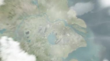 Dünya uzaydan Wuxi, Çin 'e yakınlaşır. Arkasından bulutlar ve atmosferden uzaya zum geliyor. Uydu görüntüsü. Seyahat girişi