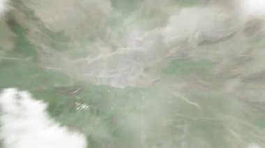 Dünya uzaydan Xian 'a, Çin' den Güney Kapısı 'na yakınlaşır. Arkasından bulutlar ve atmosferden uzaya zum geliyor. Uydu görüntüsü. Seyahat girişi