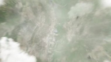 Dünya uzaydan Xingtai, Century Plaza 'daki Çin' e yakınlaşır. Arkasından bulutlar ve atmosferden uzaya zum geliyor. Uydu görüntüsü. Seyahat girişi