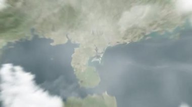 Dünya, Çin Halk Kongresi 'nde uzaydan Zhanjiang' a yakınlaşır. Arkasından bulutlar ve atmosferden uzaya zum geliyor. Uydu görüntüsü. Seyahat girişi