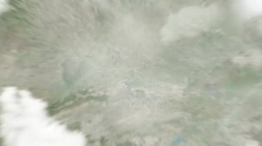 Dünya uzaydan Allahabad 'a, Hindistan' a, Khusro Bagh 'a yakınlaşır. Arkasından bulutlar ve atmosferden uzaya zum geliyor. Uydu görüntüsü. Seyahat girişi