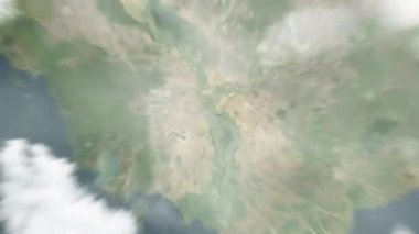 Dünya, Bağımsızlık Anıtı 'ndaki Phnom Penh, Kamboçya' ya uzaydan yakınlaşır. Arkasından bulutlar ve atmosferden uzaya zum geliyor. Uydu görüntüsü. Seyahat girişi