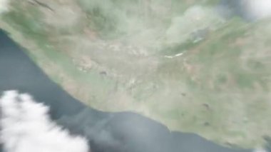 Dünya, uzaydan Guatemala City, Guatemala 'ya, Anayasa Meydanı' ndan yakınlaş. Arkasından bulutlar ve atmosferden uzaya zum geliyor. Uydu görüntüsü. Seyahat girişi