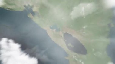 Dünya uzaydan Managua 'ya, Nikaragua' dan Rotonda de la Virgen 'e yakınlaşacak. Arkasından bulutlar ve atmosferden uzaya zum geliyor. Uydu görüntüsü. Seyahat girişi