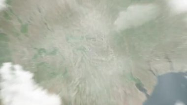 Dünya, uzaydan Chisinau 'ya, Moldova' dan Katedral Park 'a yakınlaşır. Arkasından bulutlar ve atmosferden uzaya zum geliyor. Uydu görüntüsü. Seyahat girişi