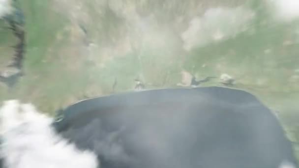 地球从太空放大到贝宁的波尔图诺沃 然后通过云层和大气变焦进入太空 卫星视图 旅行介绍 — 图库视频影像