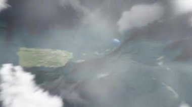 Dünya, uzaydan Fort Christian 'daki Virgin Adaları' ndaki Charlotte Amalie 'ye yakınlaşacak. Arkasından bulutlar ve atmosferden uzaya zum geliyor. Uydu görüntüsü. Seyahat girişi