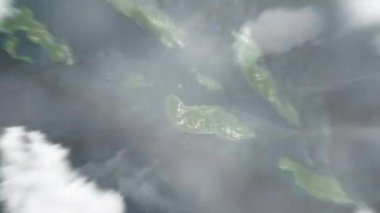 Dünya, uzaydan Honiara 'ya, Solomon Adaları' ndan Unity Meydanı 'na yakınlaşır. Arkasından bulutlar ve atmosferden uzaya zum geliyor. Uydu görüntüsü. Seyahat girişi