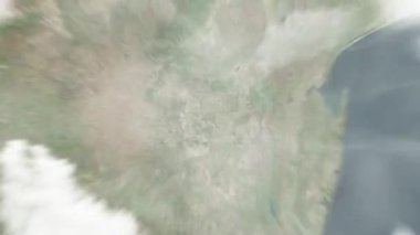 Dünya uzaydan Mbabane, Eswatini 'ye yakınlaş. Arkasından bulutlar ve atmosferden uzaya zum geliyor. Uydu görüntüsü. Seyahat girişi