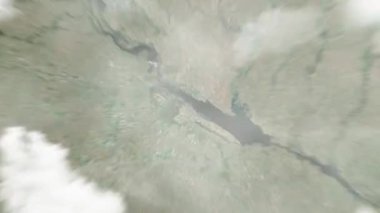 Dünya uzaydan Çerkasya 'ya, Ukrayna' dan Şarkı Söyleyen Çeşme 'ye yakınlaşır. Arkasından bulutlar ve atmosferden uzaya zum geliyor. Uydu görüntüsü. Seyahat girişi