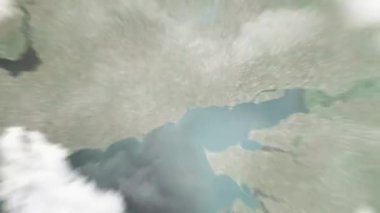 Dünya, Drama Tiyatrosu 'nda uzaydan Mariupol, Ukrayna' ya yakınlaşır. Arkasından bulutlar ve atmosferden uzaya zum geliyor. Uydu görüntüsü. Seyahat girişi