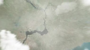 Dünya, Ploshcha Festyvalna 'daki Ukrayna' daki Zaporizhzhya 'ya uzanıyor. Arkasından bulutlar ve atmosferden uzaya zum geliyor. Uydu görüntüsü. Seyahat girişi
