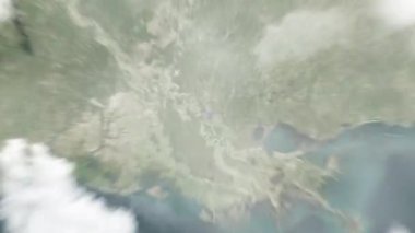 Dünya, Louisiana State Capitol 'deki Baton Rouge' a uzaydan yaklaş. Arkasından bulutlar ve atmosferden uzaya zum geliyor. Uydu görüntüsü. Seyahat girişi