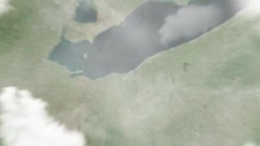 Dünya, uzaydan Cleveland, ABD 'ye, Kamu Meydanı' na yakınlaşır. Arkasından bulutlar ve atmosferden uzaya zum geliyor. Uydu görüntüsü. Seyahat girişi