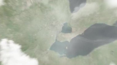 Dünya, uzaydan Detroit 'e, Martius Park Kampüsü' ndeki ABD 'ye yakınlaşacak. Arkasından bulutlar ve atmosferden uzaya zum geliyor. Uydu görüntüsü. Seyahat girişi