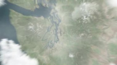 Dünya uzaydan Seattle, ABD 'ye yakınlaşacak. Arkasından bulutlar ve atmosferden uzaya zum geliyor. Uydu görüntüsü. Seyahat girişi