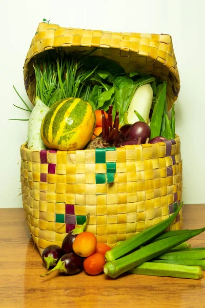 Fresh Vegetables Wicker Basket Wooden Table White Wall — Stock Photo, Image