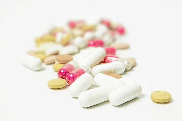 Pills Capsules White Background Focus Foreground Soft Bokeh Stock Photo