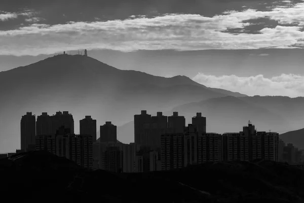 stock image silhouette city skyline and mountain. landscape of Hong Kong at dawn