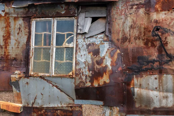 Stock image Broken window on wall of abandoned house