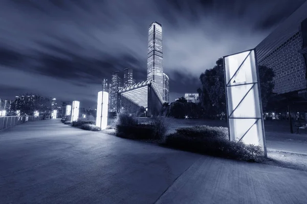 stock image Seaside promenade and skyline of Hong Kong city at night