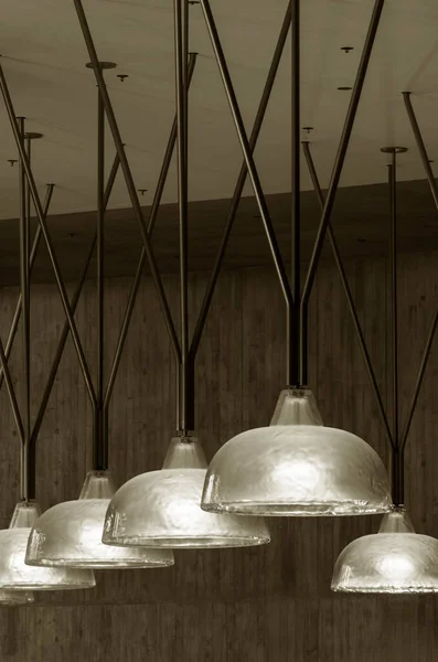 Row of pendant light lamps set in modern interior