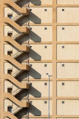 Staircase on exterior of high rise warehouse. Building abstract background