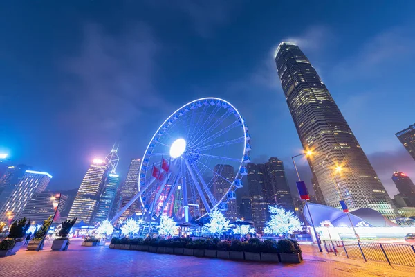 stock image Ferris Wheel in downtown of Hong Kong city at dusk