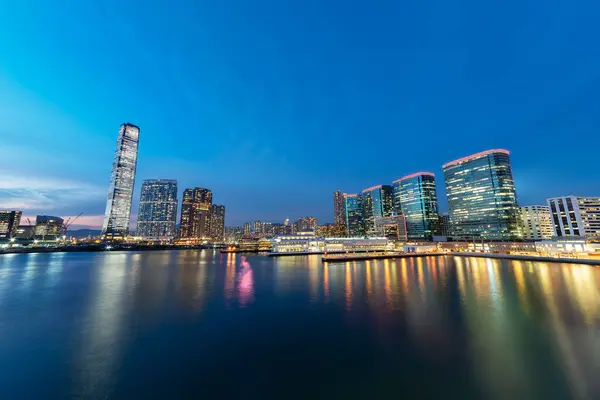 stock image Scenery of skyscraper, skyline and harbor of Hong Kong city at dusk