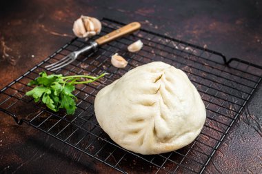 Pyan-se, Pyanse - Traditional Korean steamed pie bun with vegetable and meat. Dark background. Top view.