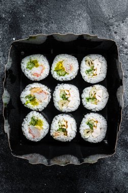 Kimbap or gimbap korean rice roll, Korean sushi. Black background. Top view.