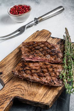 Prime Black Angus Grilled Skirt steak, beef meat. White background. Top view.