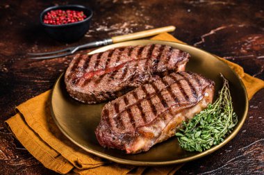 Grilled Shoulder Top Blade or Australia wagyu oyster blade beef steak. Dark background. Top View.