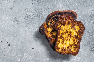Stack of delicious french toasts on table. Gray background. Top view. Copy space.