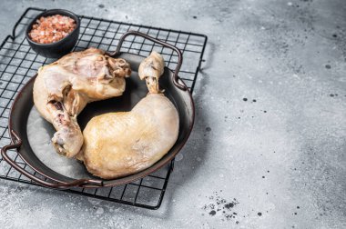 Steamed chicken leg thigh, Asia cuisine. Gray background. Top view. Copy space.