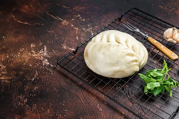 Pyan-se, Pyanse - Traditional Korean steamed pie bun with vegetable and meat. Dark background. Top view. Copy space.