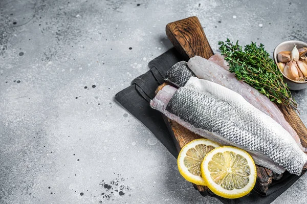 Fresh Raw Sea Bass Fillets Branzino Fish Thyme Lemon Gray — Stockfoto