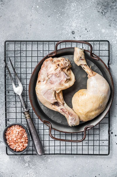 Steamed chicken leg thigh, Asia cuisine. Gray background. Top view.