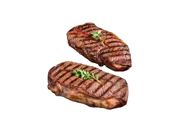 Grilled Top Blade or flat iron roast beef meat steaks on a skillet. Isolated on white background