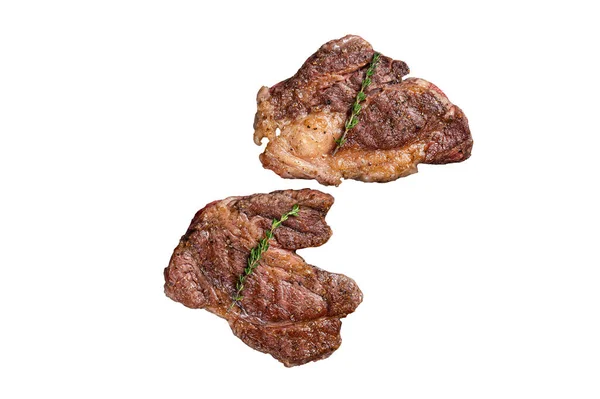 BBQ Grilled Chuck eye Roll beef steaks on grill. Isolated on white background