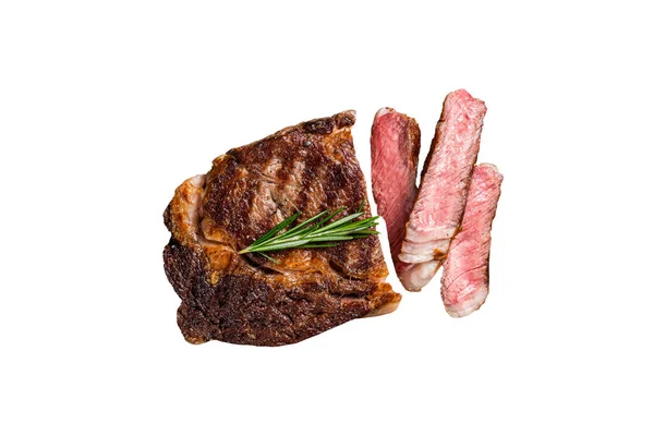 Sliced and Grilled rib eye steak, rib-eye beef marbled meat on a wooden board. Isolated on white background
