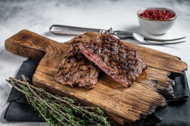 Prime Black Angus Grilled Skirt steak, beef meat. White background. Top view.