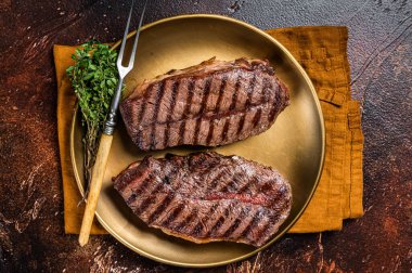 Grilled Shoulder Top Blade or Australia wagyu oyster blade beef steak. Dark background. Top View.