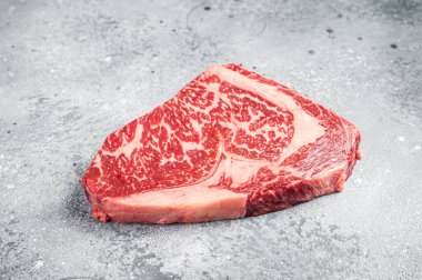 Japanese wagyu rib eye beef meat steak. Gray background. Top view.