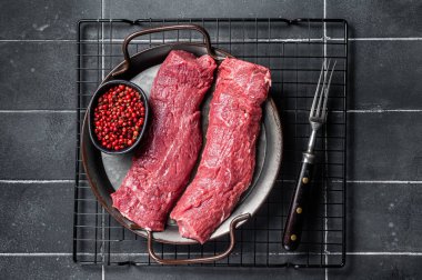 Raw lamb tenderloin Fillet, Mutton Sirloin Meat. Black background. Top view.