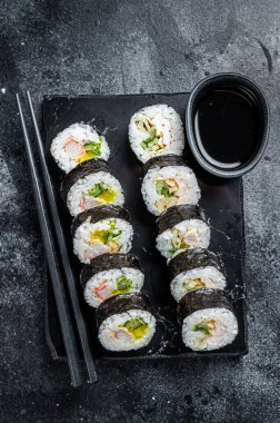 Korean rice roll Kimbap or gimbap, Korean sushi. Black background. Top view.